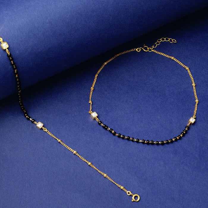 Antique silver necklace with matching earrings featuring intricate temple-inspired motifs