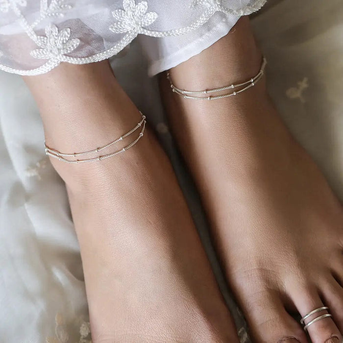 Double-chain anklet handcrafted in 92.5 silver, featuring minimalist and elegant styling
