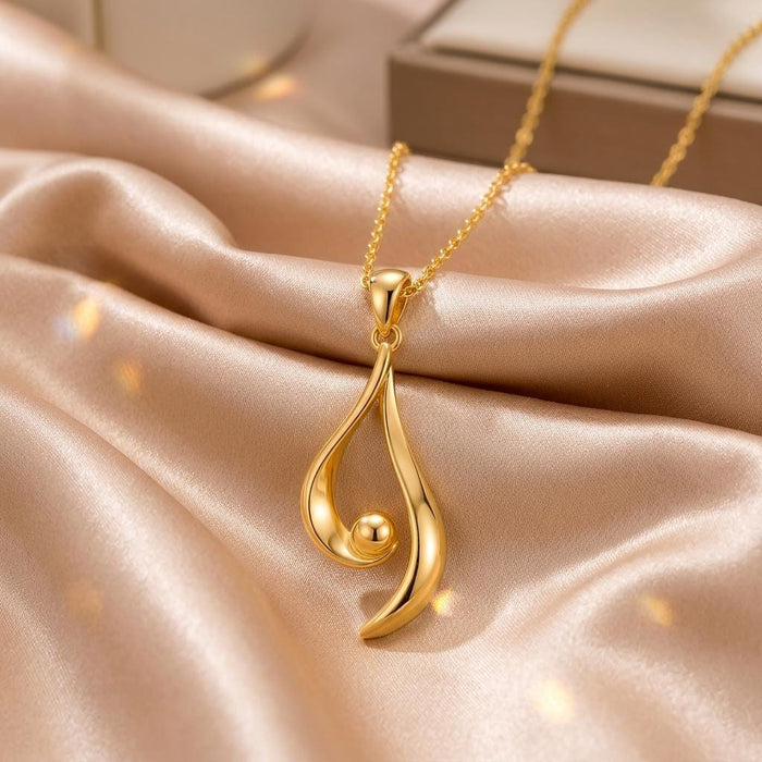 Gold Plated Silver Asymmetrical Aura Pendant with an open teardrop-like curve and round bead on champagne satin