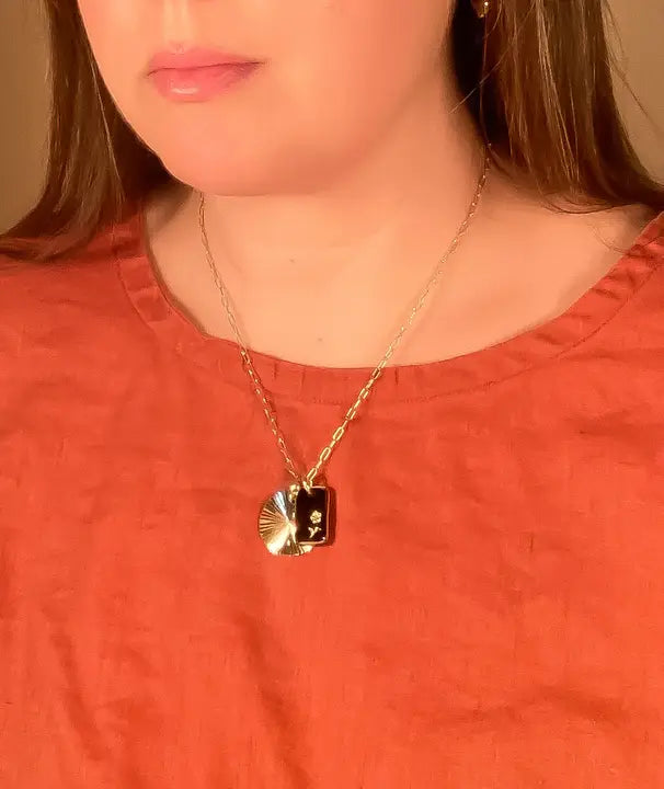 glass and sunburst charm necklace
