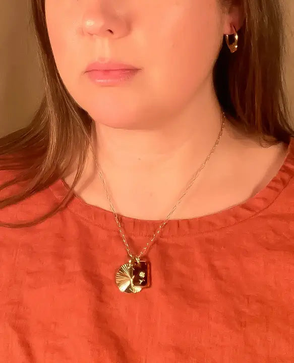 glass and sunburst charm necklace