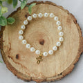 Gold and Pearl Cross Charm Bracelet