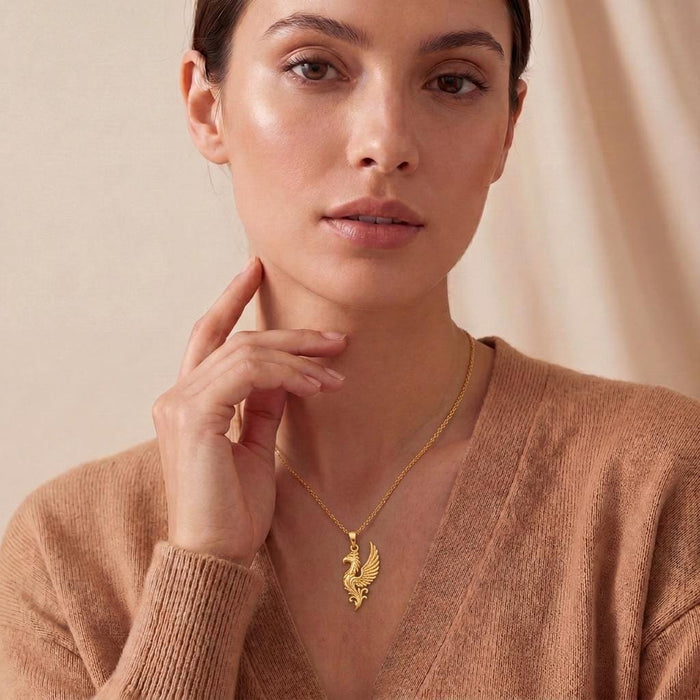 Gold Plated Silver Griffin Wing Pendant Necklace worn with a neutral V-neck knit