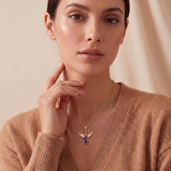 Front portrait of a woman wearing the Angel Wing Necklace at the collarbone