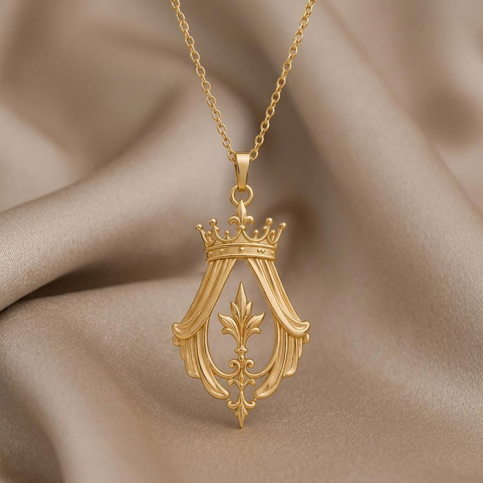 Close view of the Imperial Crown Veil Necklace pendant showing the crown, drapery-inspired sides, fleur-de-lis motif, and pointed scrollwork