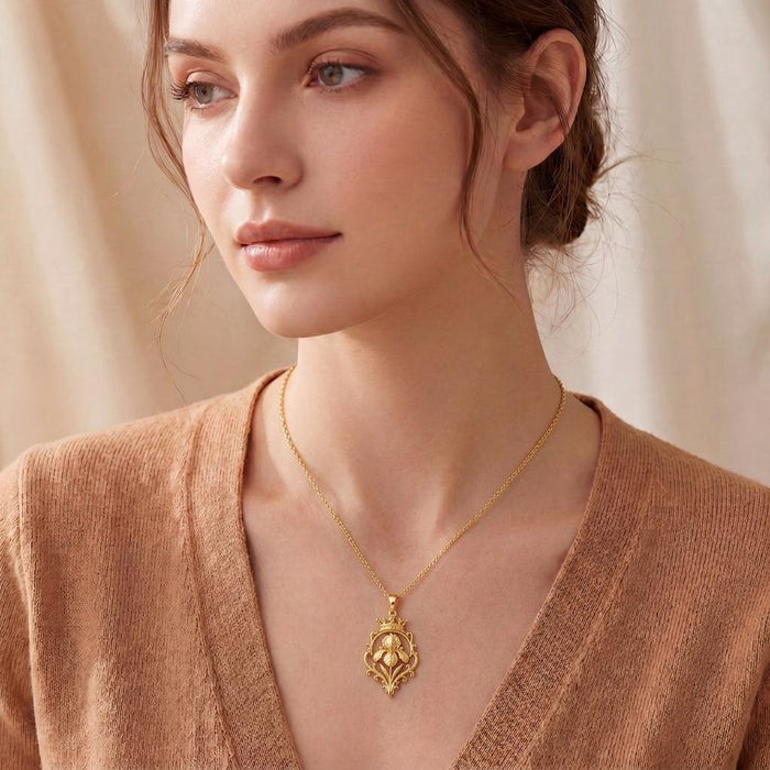 Model wearing the Gold Plated Silver Noble Iris Throne Necklace with a V-neck knit top