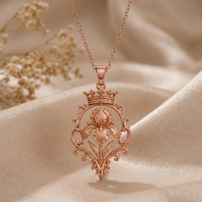 Rose Gold Plated Noble Iris Throne Necklace with crowned iris pendant on cream satin
