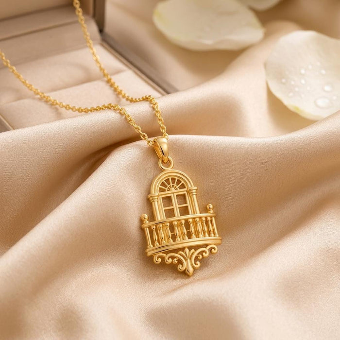 Gold Plated Silver Royal Balcony Pendant Necklace on champagne satin beside pale petals