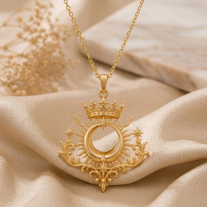 Gold Plated Silver Royal Eclipse Tiara Pendant with paired stars and ornate scrollwork on draped champagne satin