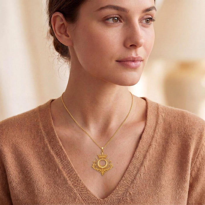 Model wearing the Gold Plated Silver Royal Eclipse Tiara Pendant with a V-neck knit top