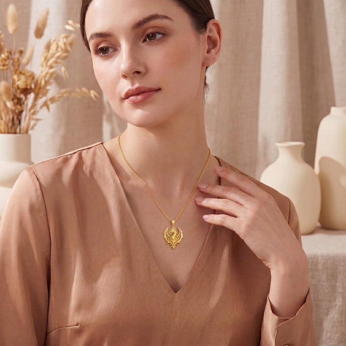 Gold Plated Silver Dragon Crest Pendant worn with a satin V-neck blouse