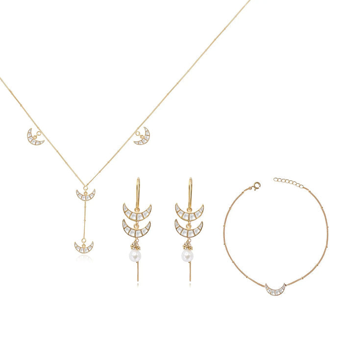 Unniyarcha 92.5 pure silver Chand (moon-shaped) jewelry set, with intricate traditional motifs in earrings and pendant.
