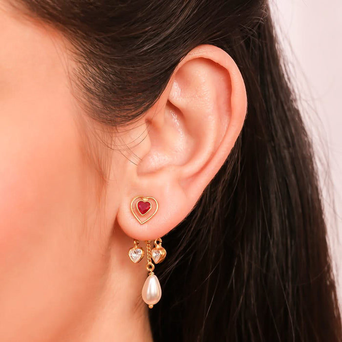Close-up of silver oxidized jhumka earrings with intricate floral patterns