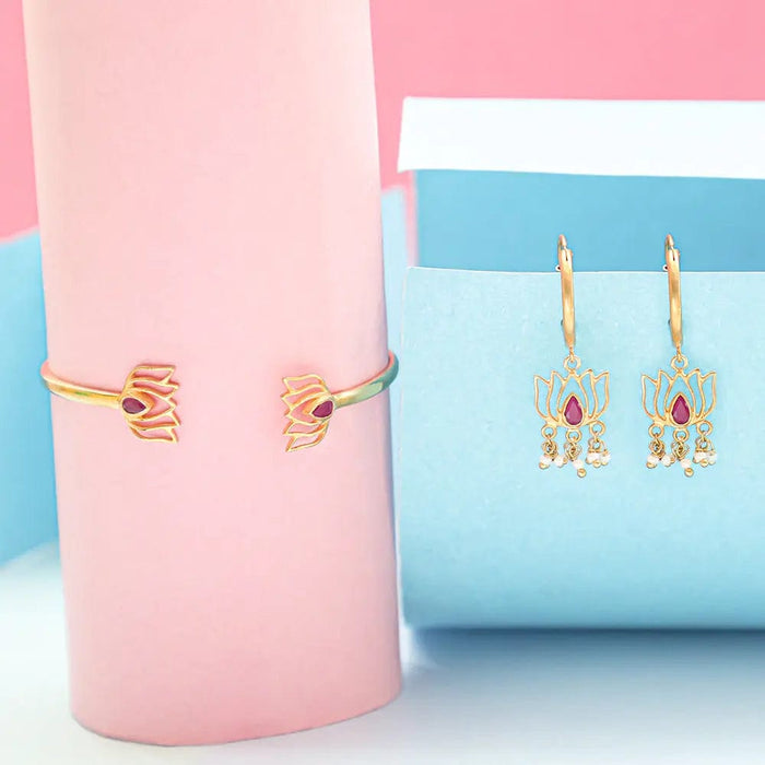 Unniyarcha silver lotus-themed bangle and matching earrings set, featuring engraved lotus motifs in 92.5 silver