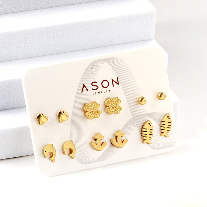 Six pairs of mixed card mounted cut-out shell / fishbone / dolphin stud earrings gold color asonjewelry