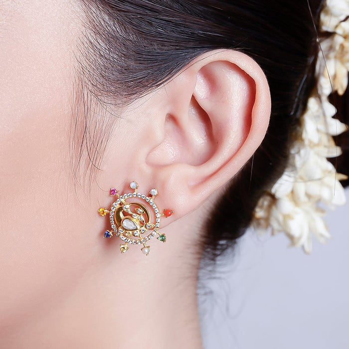 Close-up of a model wearing oxidized silver earrings and necklace set with ethnic styling