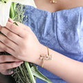 TWO BUTTERFLY MOTIF SILVER BANGLE