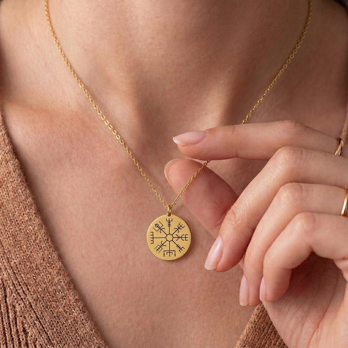 Gold Plated Silver Vegvisir Compass Necklace worn at the neckline with the engraved round compass pendant visible