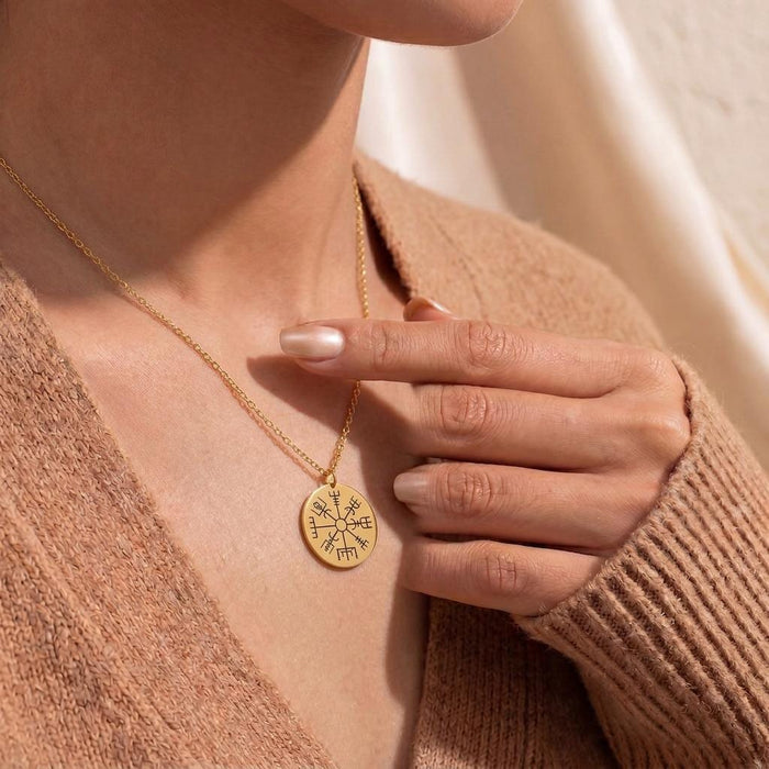 Gold Plated Silver Vegvisir Compass Necklace worn over a knit top with the engraved round pendant visible